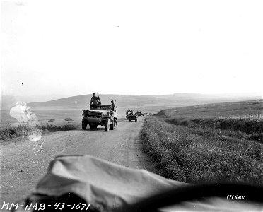 SC 171645 - The 34th Infantry Division moving ahead to Mateur, Tunisia, after the Germans were driven out. 3 May, 1943. photo