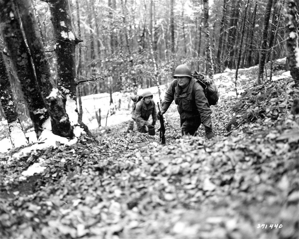 SC 271440 - Pfc. Creed Johns of Nicholasville, Kentucky, left, and Pvt. Joseph Koreal, Cleveland, Ohio, members of a pioneer squad of the 1st Battalion, 157th Regiment, 45th Division, whose job is to carry rations and supplies to soldiers in foxholes...