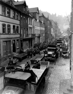 SC 336811 - Troops, vehicles, assault boats and other equipment fill the streets of St. Goar, Germany, as the 89th Division, Third U.S. Army, prepares to cross the Rhine River at this point. 26 March, 1945. photo