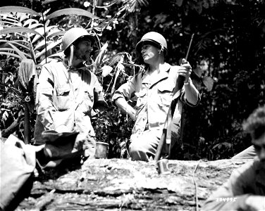 SC 334995 - Capt. Cecil Bayless, CO of M Company mortar, 3rd Battalion, 27th Infantry, left, and Gen. J. Lawton Collins, CG of the 25th Division... photo