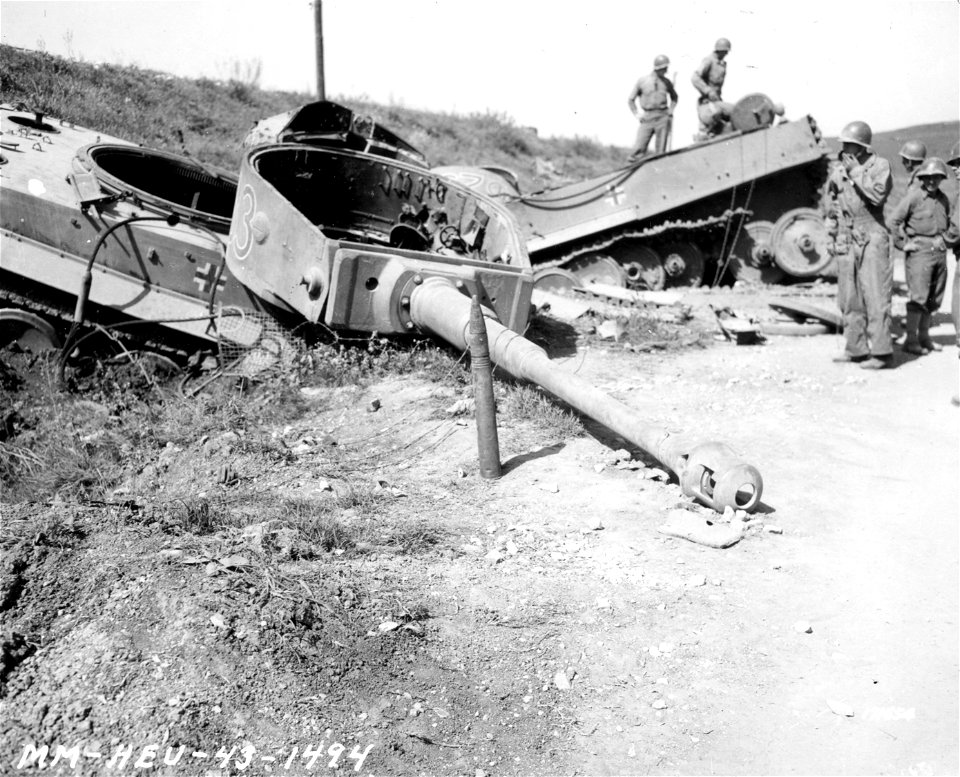 SC 171654 - Medium shot of the turret, gun and 88mm shell of a German Mark VI tank. Beja, Tunisia. 23 April, 1943.