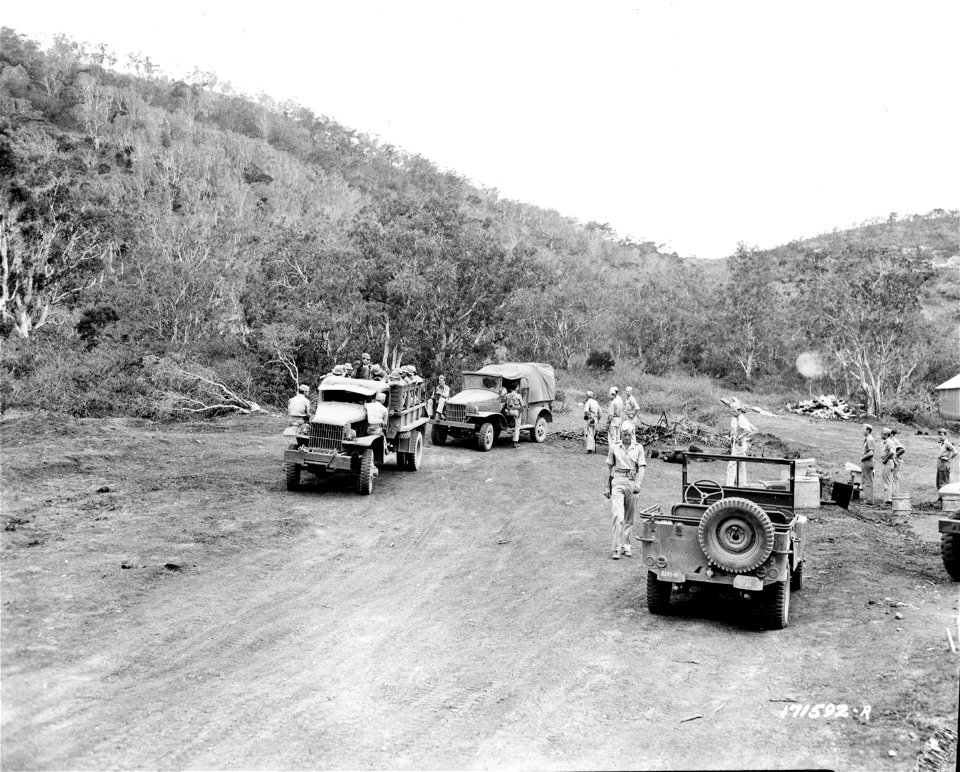SC 171592-R - Jap prisoners leaving temporary encampment for permanent prison camp just completed. First Island Command. 7 January, 1943.