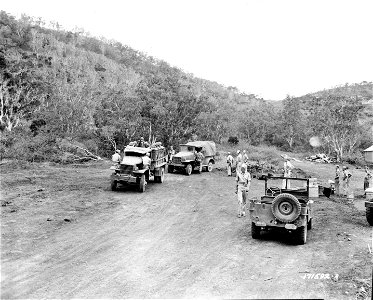 SC 171592-R - Jap prisoners leaving temporary encampment for permanent prison camp just completed. First Island Command. 7 January, 1943. photo
