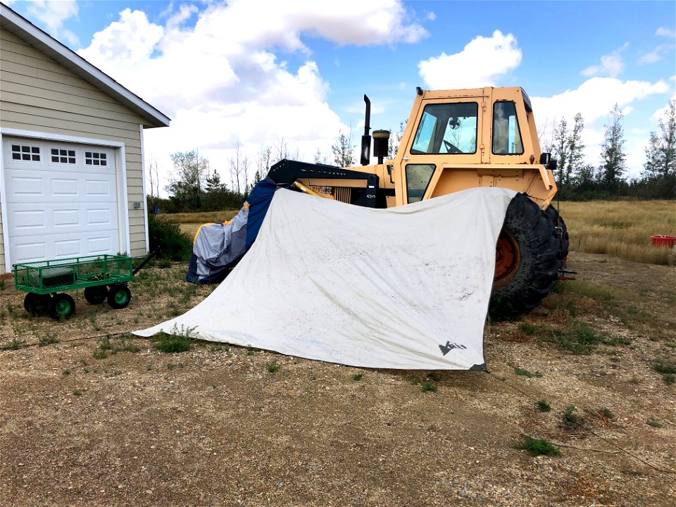 Tractor also a Place to Hang a Tent to Dry