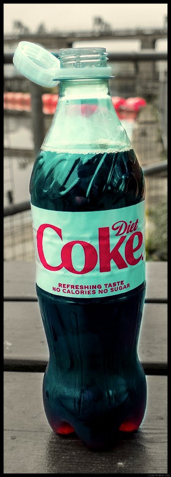 The lid stays attached to the bottle. Simple but genius design.