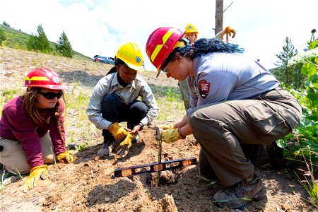 YCC Alpha Crew 2021 Grizzly Lake Trailhead sign install: measuring post hole depth photo