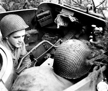 SC 195753 - Cpl. Robert Sypniewski prepares to fire an assault gun. North of Monschau, Germany.