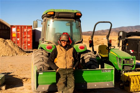 Tractor and operator out in the field