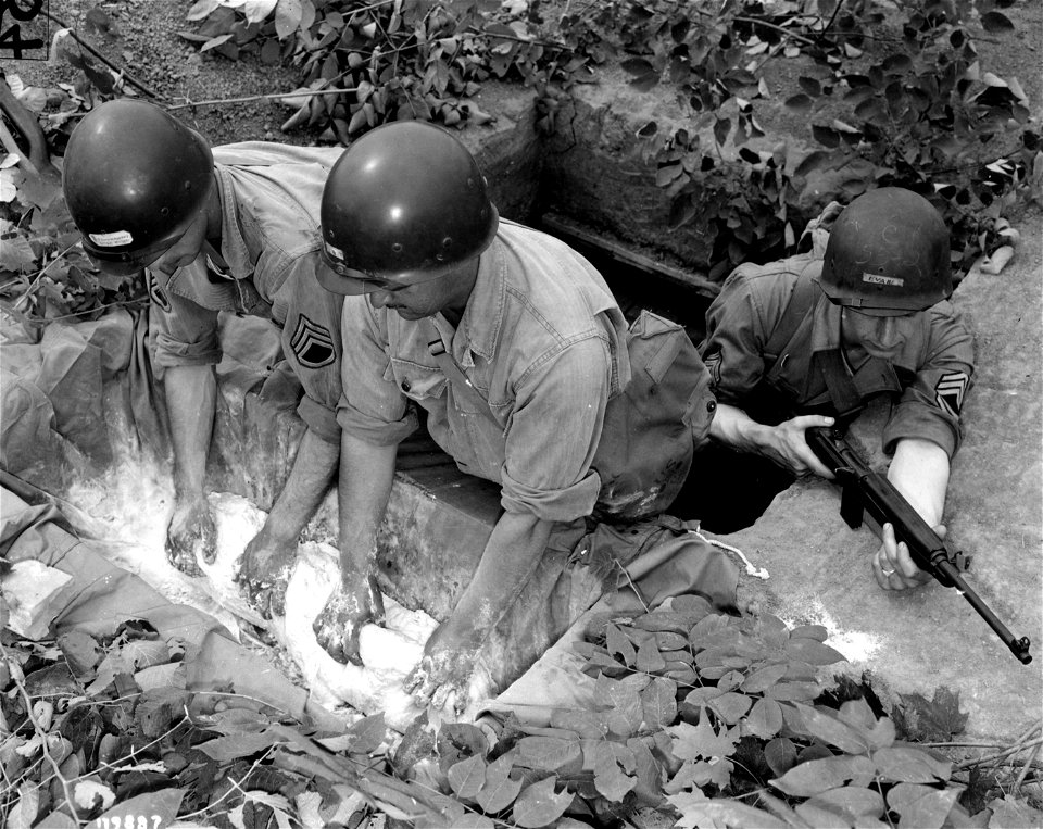 SC 179887 - The baking school of the Quartermaster Group at Camp Mills, Ill., while teaching its men the use of the most modern camp and field baking equipment, also trains them to improvise ovens and other equipment...