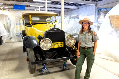 Miriam Watson, Museum Curator, with historic vehicle collection photo