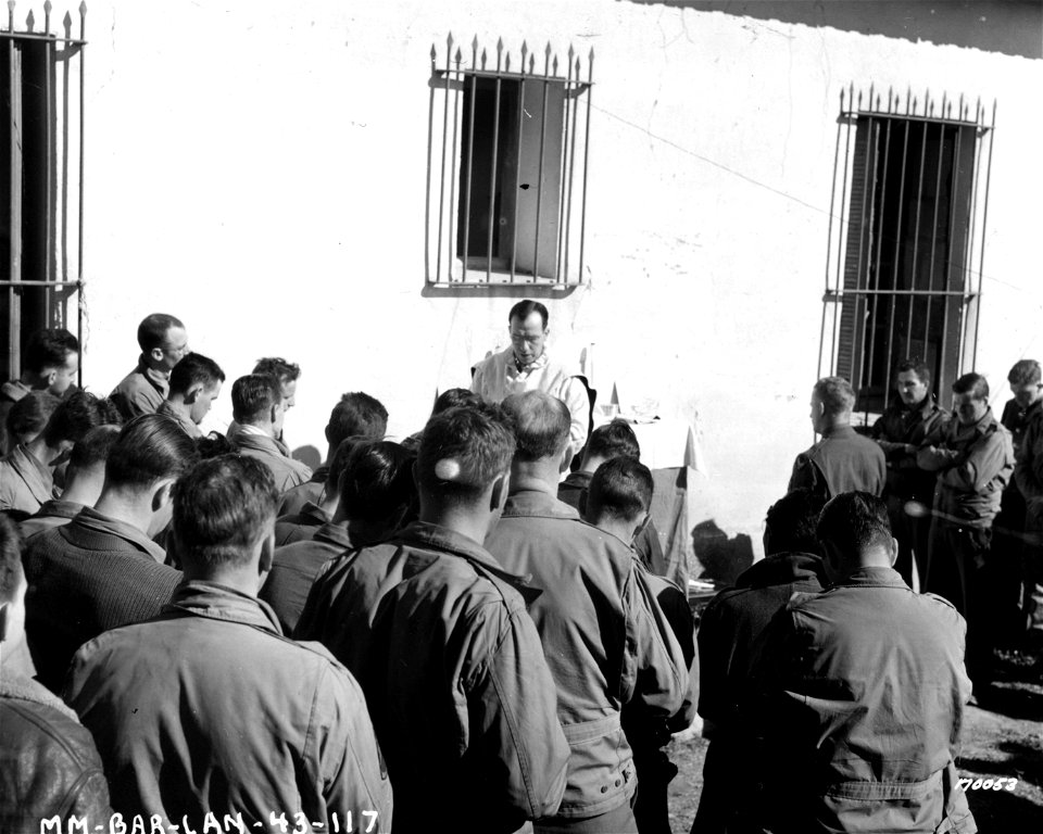 SC 170053 - Chaplain Walter J. Poynton, Inglewood, N.J., conducting church services at the headquarters of a bomber group. 12 February, 1943.