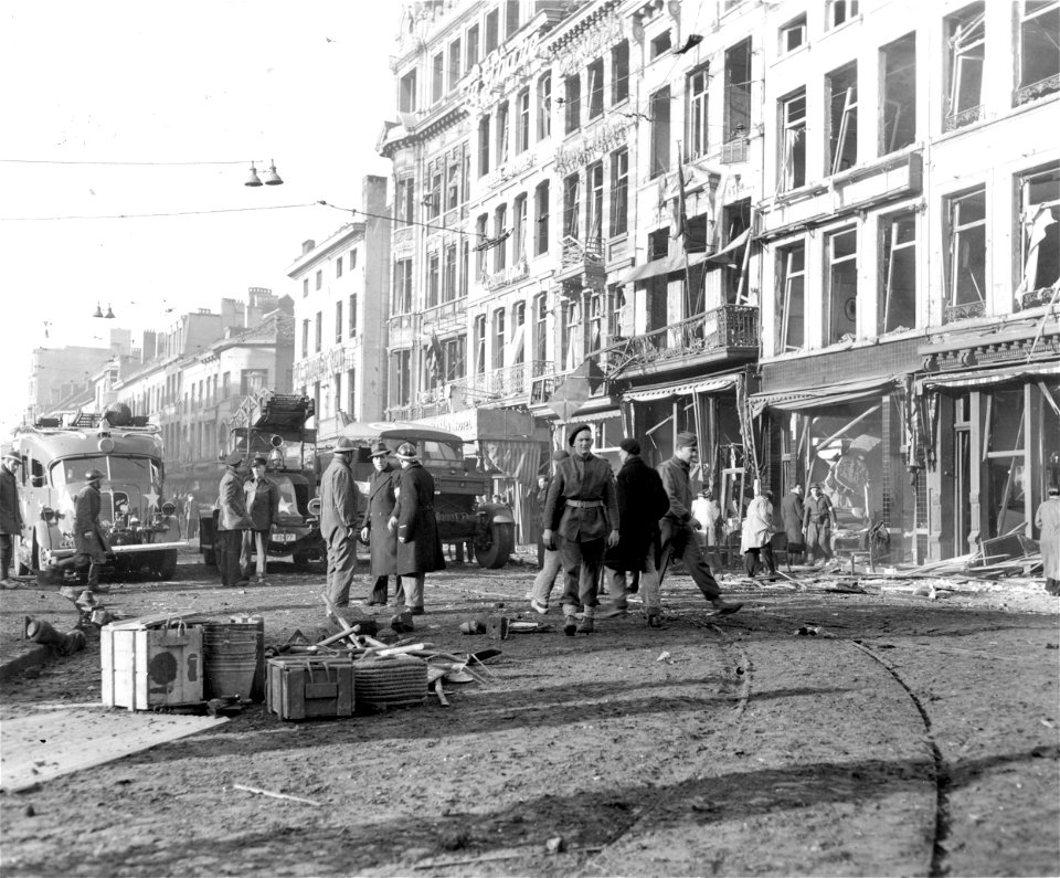 SC 329800 - Rescue squads work amidst damage caused in a large Belgian city when a German V-1, flying bomb, exploded. 5 January, 1945.