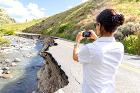 Yellowstone flood event 2022: Secretary Haaland taking photos of the damage near Rescue Creek