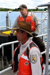 Cory Racine, Biological Science Technician, and James Criger, Lead Physical Science Technician work to treat the St. Mary's River for sea lamprey in upper Michigan photo