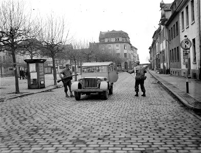 SC 336800 - After the fall of Uerdingen, Germany, to infantrymen of the 95th Infantry Division, guards are posted in streets of town to prevent infiltration by the enemy.
