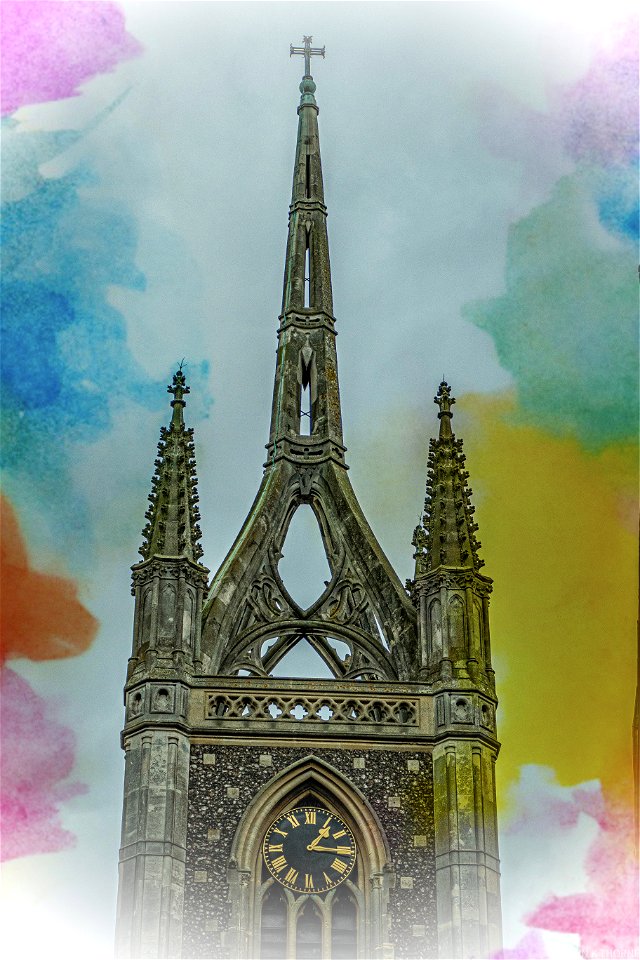 openwork spire of brick built at the west end of the church which was encased in stone in 1855 by George Gilbert Scott  Faversham Church