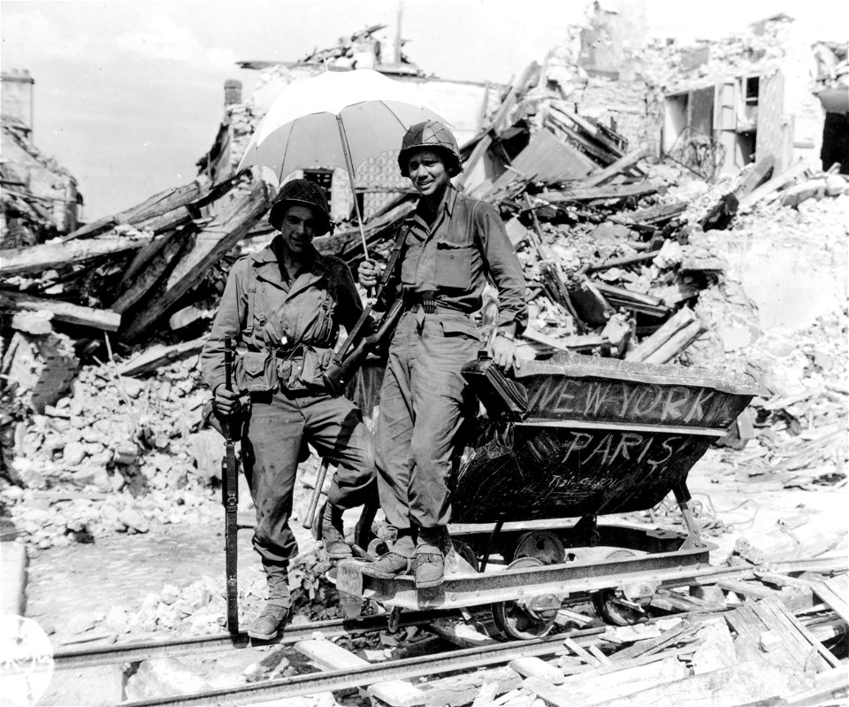 SC 396791 - New York to Paris Special finds Pfc. Darrel O. Salisbury, Aberdeen, Wash., and Sgt. Robert H. Harrill, Charlotte, N.C., as first class passengers. This "scooter" was used by Nazis in Mantes.