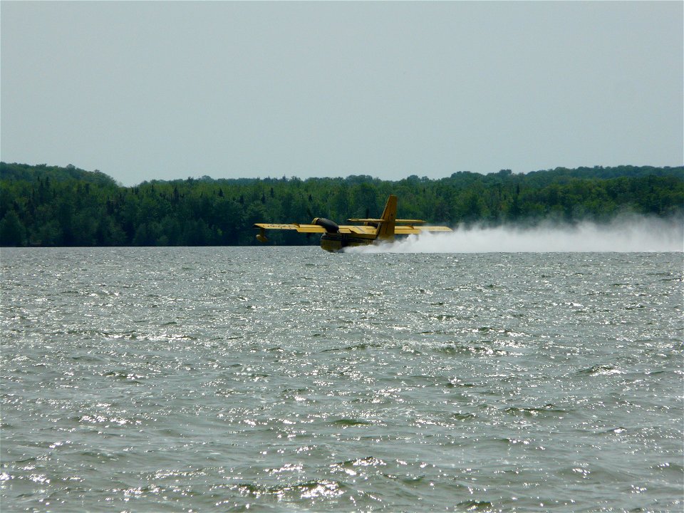 CL-215 Picking up water from Big Manistique Lake