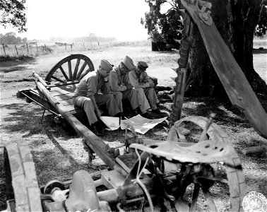 SC 329930 - Lt. Gen. Ira C. Baker, C.G., MAAF, Lt. Gen. Jacob L. Devers, Deputy Supreme Allied Commander, Med. Theater, and Maj. Gen. Joe Gannon, C.G., 12th Air Force, looking at positions established by Allied troops in landings in Southern France.