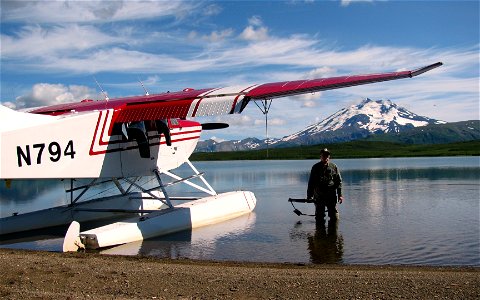 Pete Finley and plane on Mother Goose Lake photo