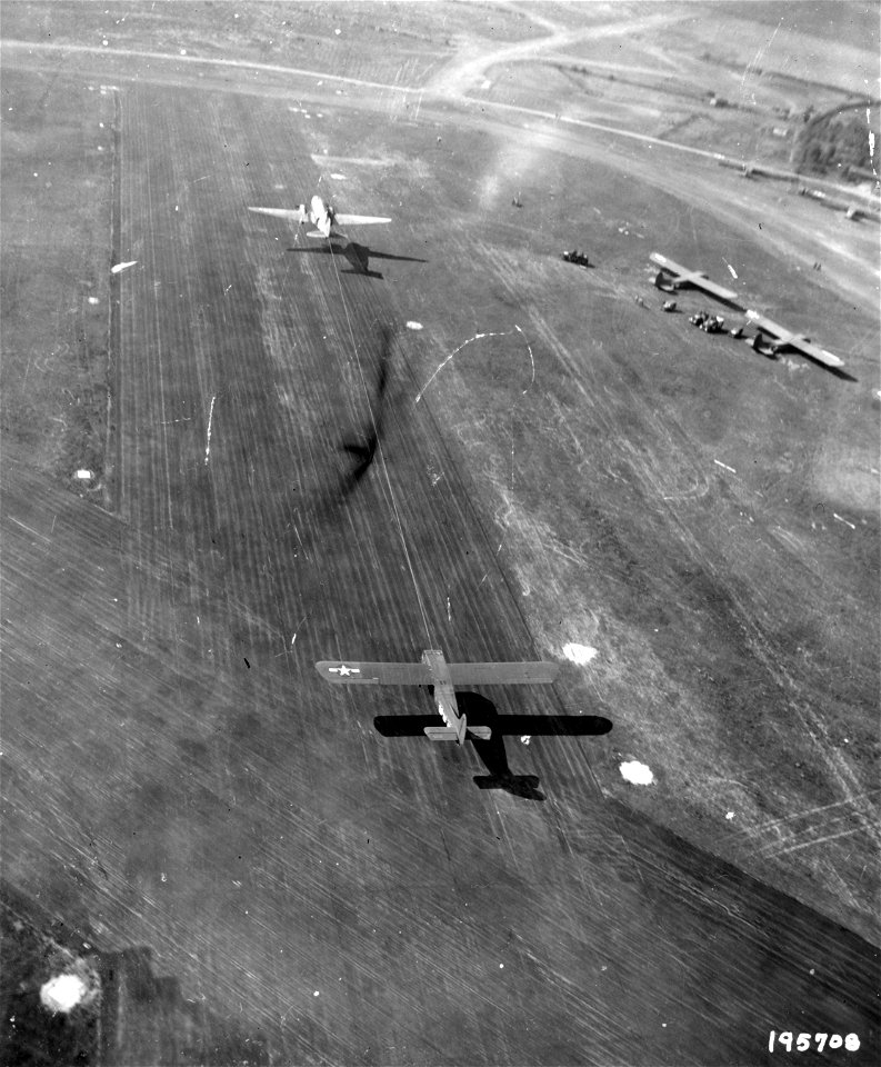 SC 195708 - Holland is the next stop for this glider, shown being towed from an airport in England by a C-47 transport as the First Allied Airborne Army begins its airborne invasion. 17 September, 1944.
