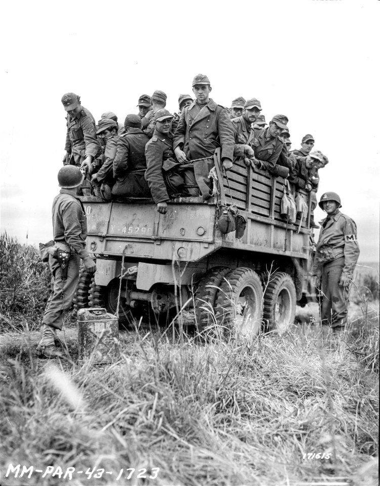 SC 171625 - Military Police of the 1st Armored Division giving water to thirsty German prisoners. Tunisia, North Africa. 8 May, 1943.
