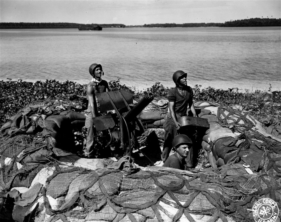 SC 364495 - A 50. cal. water-cooled machine gun and crew at the old jetty on Orange Beach, Arawe, New Britain.