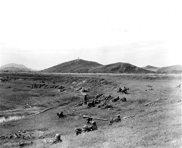 SC 348903 - Troops of the 19th Regt., 24th Inf. Div. rest after crossing the Naktong River. 20 September, 1950. photo