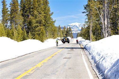 Spring biking with heavy machinery on the road