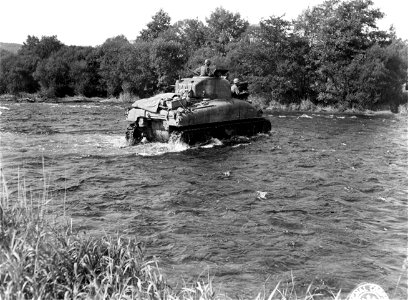 SC 195715 - Tank of 191st Tank Bn. crossing Moselle River north of Arches to give support to 3rd Bn. of 179th Regt., 45th Div. photo