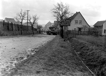 SC 335614 - Armor and infantry of the 6th Armored Division, 3rd U.S. Army, advance to take town of Oberdorla, Germany. 4 April, 1945. photo
