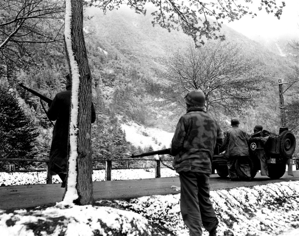 SC 337388 - (409th Task Force photo series) Here, men watch the mountainside for the slightest movement from the enemy, to provide them a target upon which to open fire. 1 May, 1945.