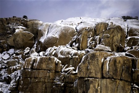 Snow-dusted rock formations photo