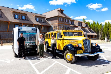 Transportation in Yellowstone, old and new: Beep and Xanterra Drivers with NPS employee (2) photo