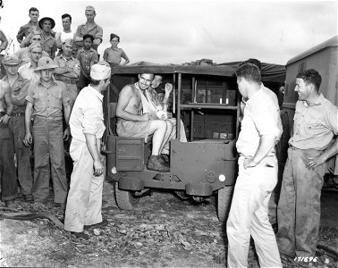 SC 171698 - First Island Command, New Caledonia. Injured from Solomon Islands, soldiers of the U.S. Army, are loaded into ambulance peeps as they are hurried to hospitals in New Caledonia. photo