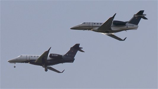 Two Embraer 505 Phenom 300 flying in at Oberpfaffenhofen: