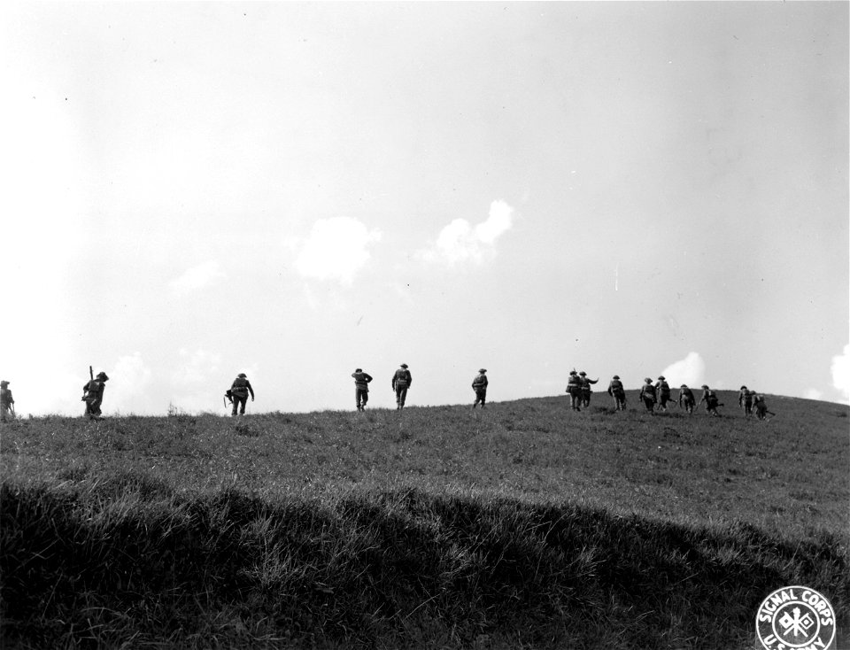SC 374848 - Infantrymen of the Jewish Brigade leave the road and cut across country on their way to the front. 28 March, 1945.