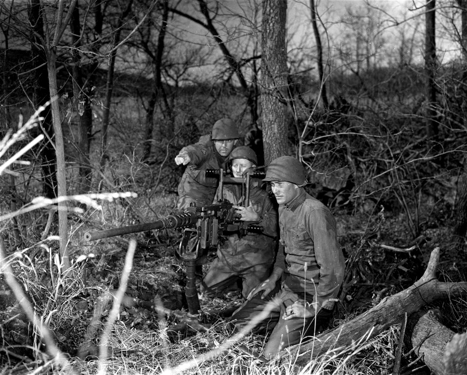 SC 364245 - A .50 caliber machine gun crew from the 46th Engr. Const. Bn. at Fort Sil, Okla., prepares to open up on an approaching enemy tank during realistic training problem on the Fort Sill range.