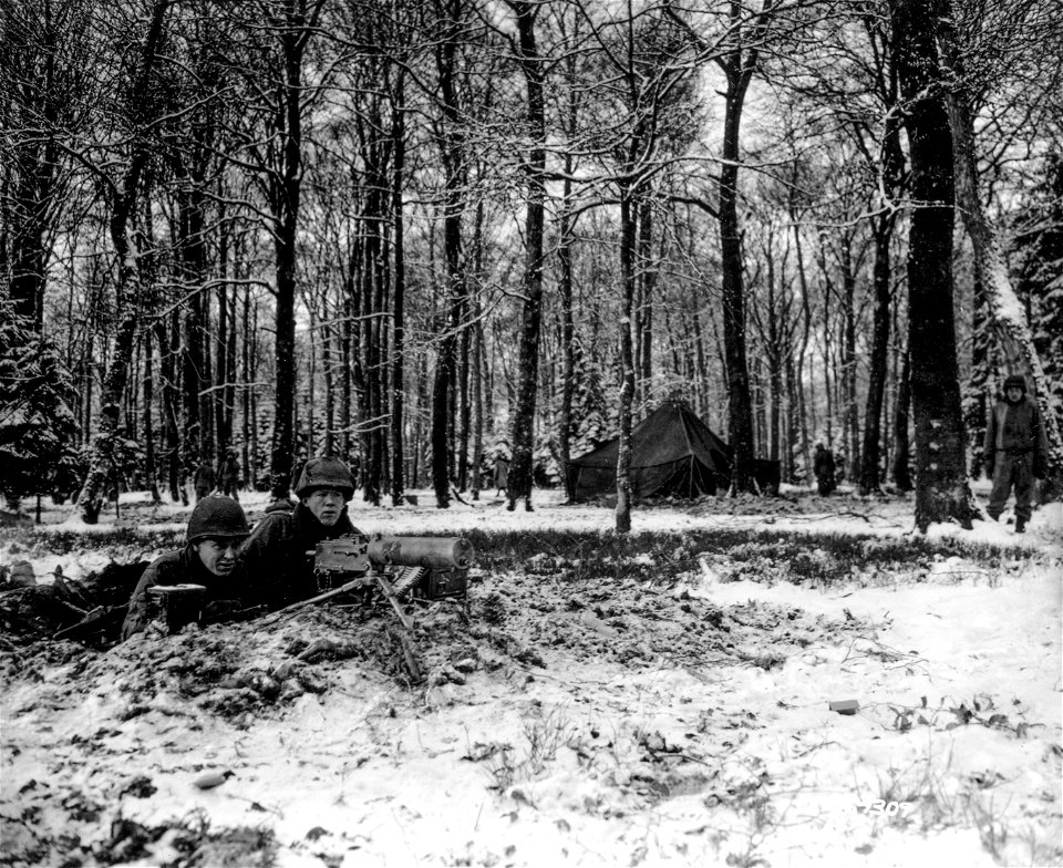 SC 364309 - Pfc. John Mincek, Hooverville, P.A., left, and Pfc. Luther F. Jack, (?) Ktowah, Tenn., machine gun squad protects a Third Army command post (tent in background) on the front line area.