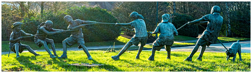 TUG OF WAR KINGS HILL WEST MALLING KENT  BY W STANLEY PROCTOR This 20 ft long bronze sculpture, installed in 2002, features six children – three boys and three girls – plus a dog, pulling the rope in a tug of war.