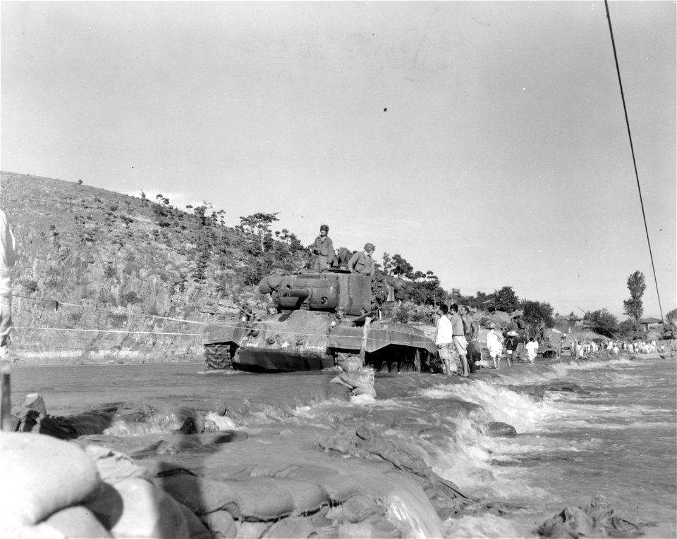 SC 348668 - M-26 tanks of the 6th Tank Bn., 24th Inf. Div. crossing the Kumho River on an underwater crossing, consisting of rocks and sandbags reinforcing the riverbed...