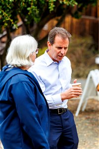 Attendees exchange words with regional director photo