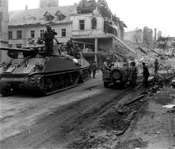 SC 335267 - A jeepload of 94th Div., 3rd U.S. Army medics moves through the ruined streets of Hermeskeil, Germany. 16 March, 1945.