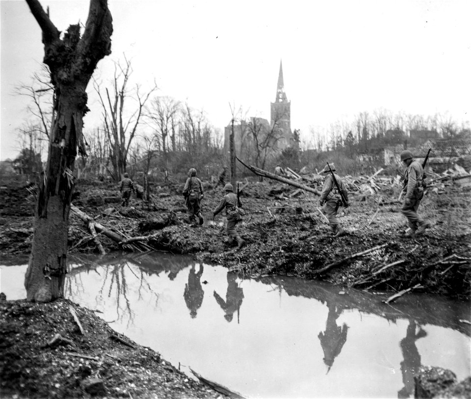 SC 374833 - Discovering no enemy positions, infantrymen of the 35th Division close up and move more confidently toward German town of Unterbruch while on reconnaissance mission for the unit of the 35th Division in Heinsberg.