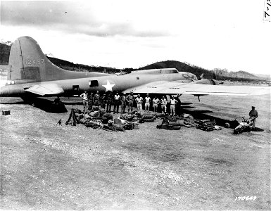 SC 170649 - This is the plane, the men, and the equipment which took part in the experimental flight to move field artillery by air. photo