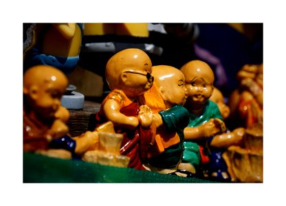 Cute young monk figurines photo