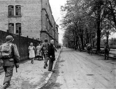 SC 335311 - Troops pass through Heilbronn after initial German resistance crumbled. 13 April, 1945. photo