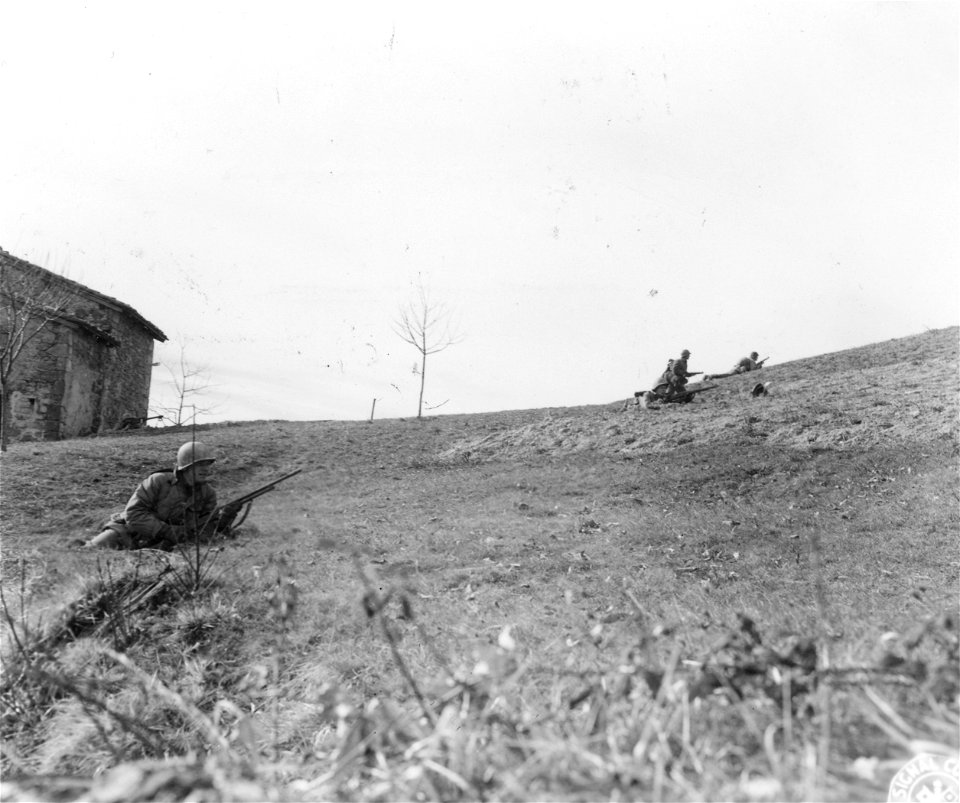 SC 270855 - Riflemen of "F" Co., 87th Mtn. Inf., 10th Mtn. Div., cautiously advance up German-held hill north of Sassomolare.