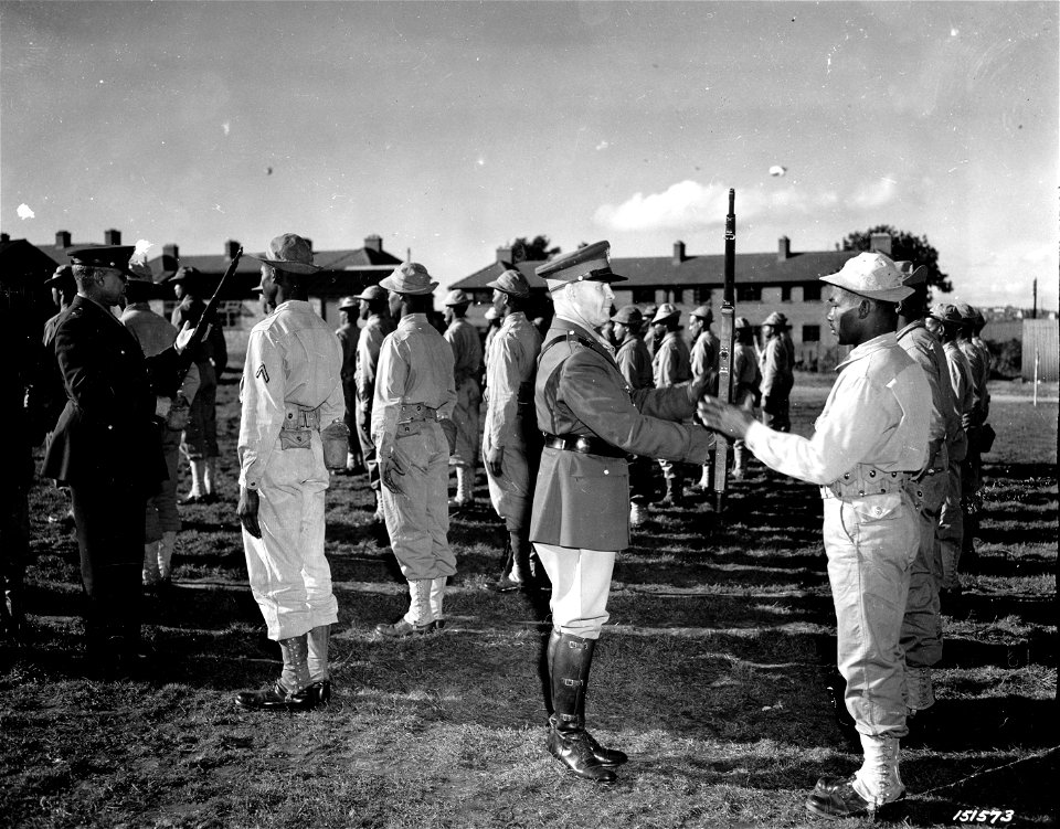 SC 151573 - Brig. Gen. Benjamin O. Davis, left, and Maj. Gen. John C.H. Lee inspect troops during a tour of colored soldiers somewhere in England. 2 October, 1944.