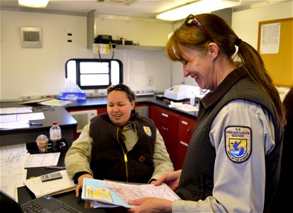 Jenna Tews (L) and Shawn Nowicki (R) discuss treatment locations during the 2015 Conneaut Creek treatment. photo